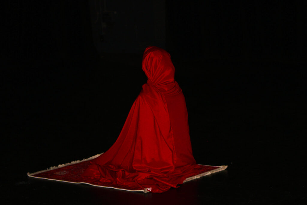 Samia Guled sitting in Tashahhud position, Regis Hall.